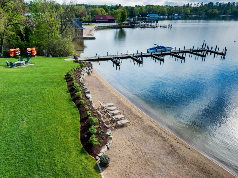 Lay out in the sand on almost 200 feet of beach along Lake Winnipesaukee